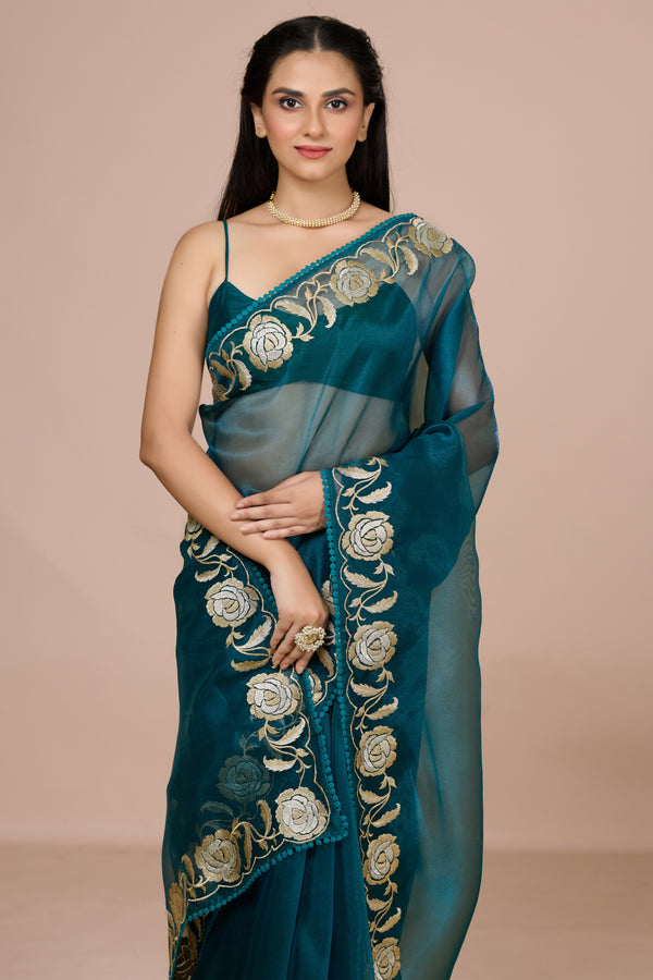 Ocean Blue Tissue Saree Adorned With An Embroidered Floral Border